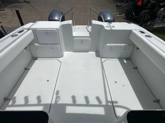 Slide: The Image of 2006 Glacier Bay 2240 SX Renegade boat deck, spacious and clean with storage compartments. - 18