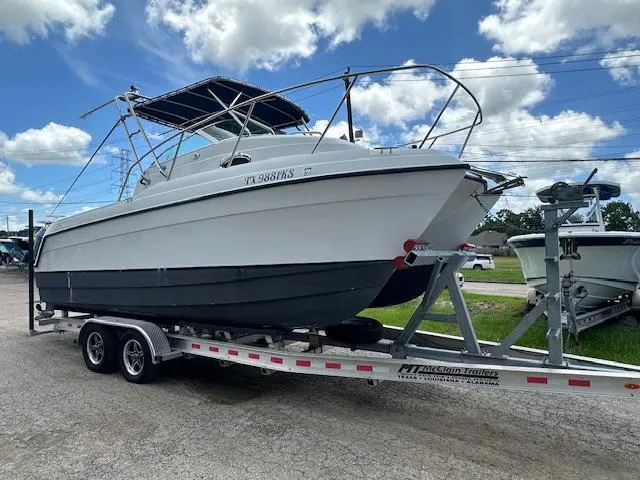 Slide: The Image of 2006 Glacier Bay 2240 SX Renegade boat with dual outboard motors on a trailer. - 3