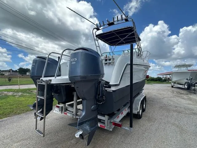 Slide: The Image of 2006 Glacier Bay 2240 SX Renegade boat on trailer under blue sky. - 5