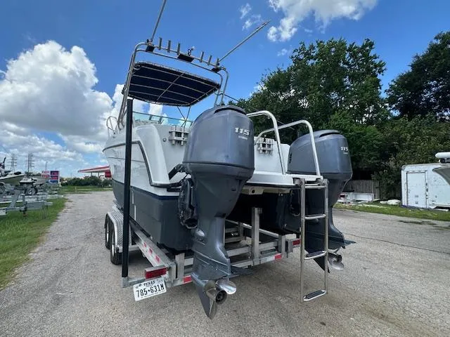 Slide: The Image of 2006 Glacier Bay 2240 SX Renegade boat on trailer with dual outboard motors. - 6