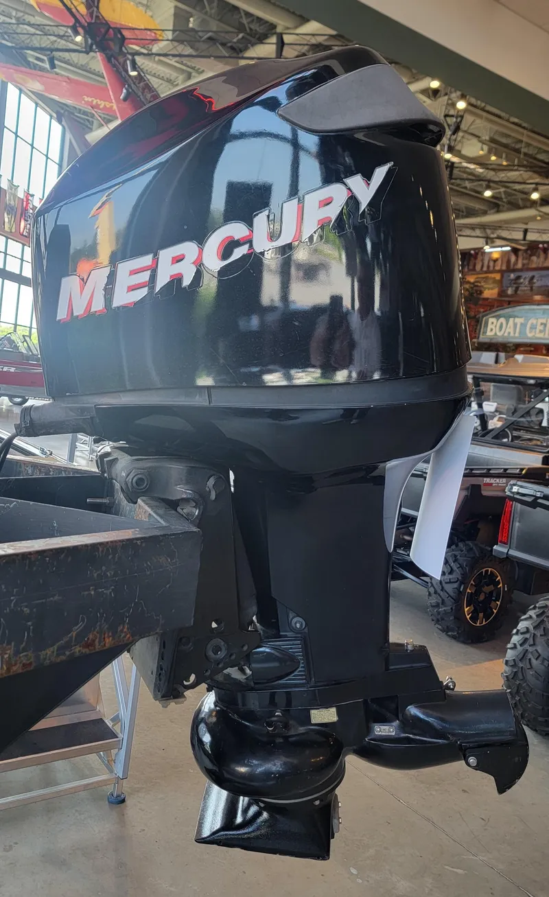 Slide: The Image of 2006 Mercury 90/65 JET OptiMax outboard motor displayed in a showroom. - 3