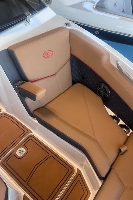 Slide: The Image of 2025 Cobalt R6 Surf boat interior with tan leather seating and modern design. - 11