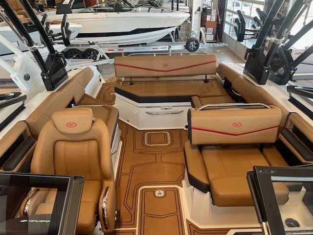 Slide: The Image of 2025 Cobalt R6 Surf boat interior with luxurious tan seating and modern design. - 12