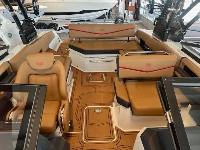 Slide: The Image of 2025 Cobalt R6 Surf boat interior with luxurious tan seating and modern design. - 13
