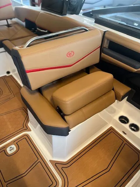 Slide: The Image of 2025 Cobalt R6 Surf boat interior with tan leather seating and modern design. - 15