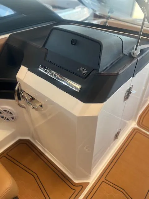 Slide: The Image of 2025 Cobalt R6 Surf boat interior with sleek design and modern features. - 16