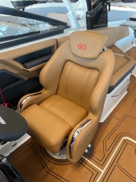 Slide: The Image of Luxurious tan leather seat in 2025 Cobalt R6 Surf boat interior. - 18