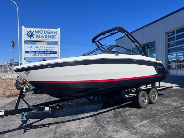 Slide: The Image of 2025 Cobalt R6 Surf boat on trailer at Modern Marine dealership. - 2