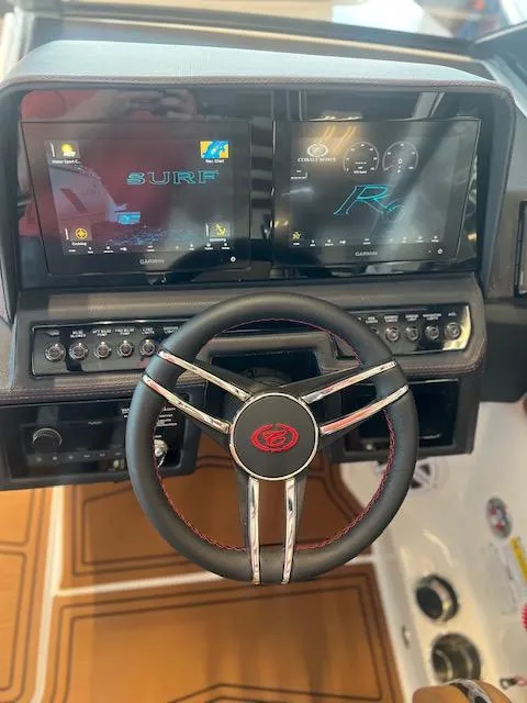 Slide: The Image of 2025 Cobalt R6 Surf dashboard with dual displays and modern steering wheel. - 22