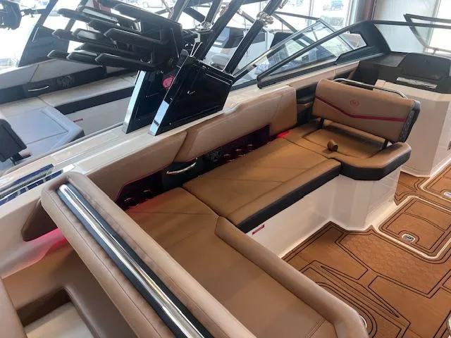 Slide: The Image of 2025 Cobalt R6 Surf boat interior with luxurious tan seating and modern design. - 29