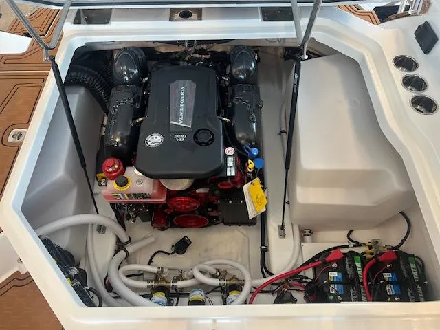 Slide: The Image of Engine compartment of a 2025 Cobalt R6 Surf boat, showcasing modern mechanical components. - 32