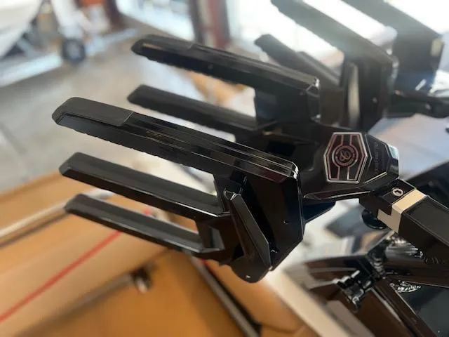 Slide: The Image of Close-up of 2025 Cobalt R6 Surf boat accessory, featuring sleek black metal components. - 34