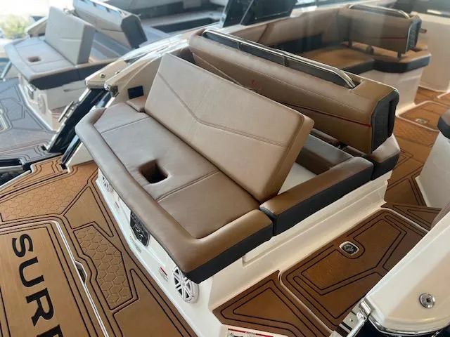 Slide: The Image of 2025 Cobalt R6 Surf boat interior with tan seating and stylish design. - 36