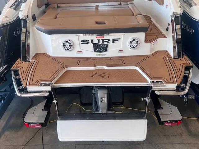Slide: The Image of 2025 Cobalt R6 Surf boat with tan deck and swim platform. - 39