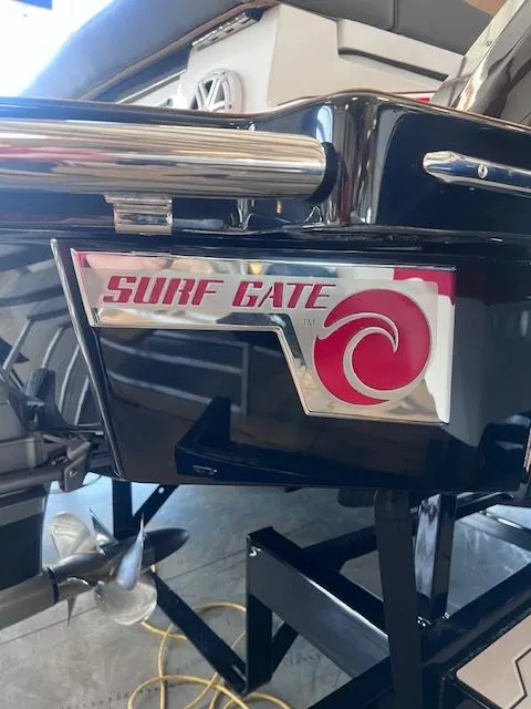 Slide: The Image of 2025 Cobalt R6 Surf boat with Surf Gate feature, enhancing wake surfing experience. - 40