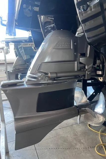 Slide: The Image of 2025 Cobalt R6 Surf boat engine and propeller detail in a showroom. - 41