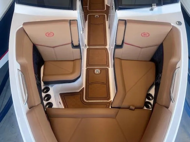 Slide: The Image of 2025 Cobalt R6 Surf boat interior with tan seating and sleek design. - 5