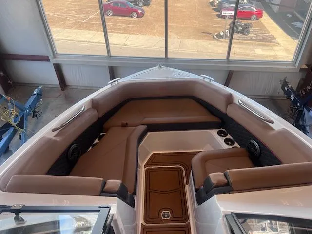 Slide: The Image of 2025 Cobalt R6 Surf boat interior with brown seating and modern design. - 6