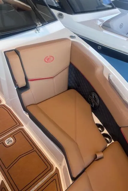 Slide: The Image of 2025 Cobalt R6 Surf boat interior with tan seating and modern design. - 9