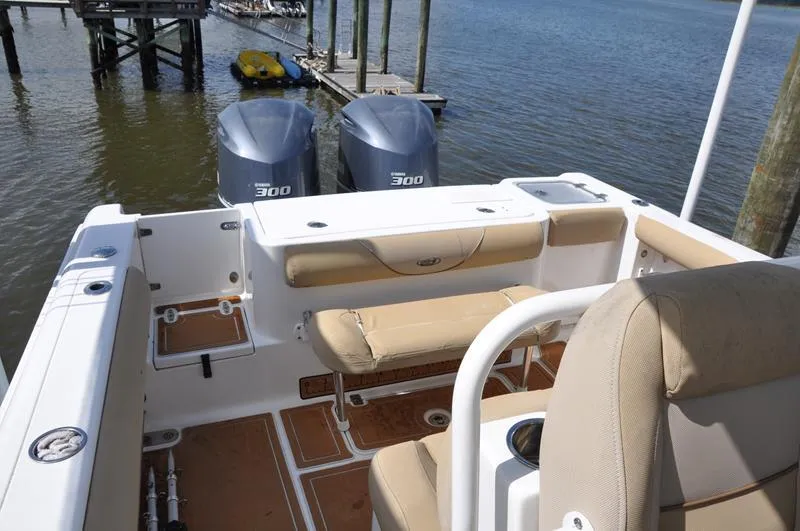 Slide: The Image of 2015 Sea Hunt Gamefish 30 boat with dual 300 engines at dock. - 11