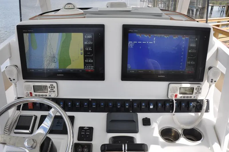 Slide: The Image of Control panel of a 2015 Sea Hunt Gamefish 30 with dual Garmin displays. - 14