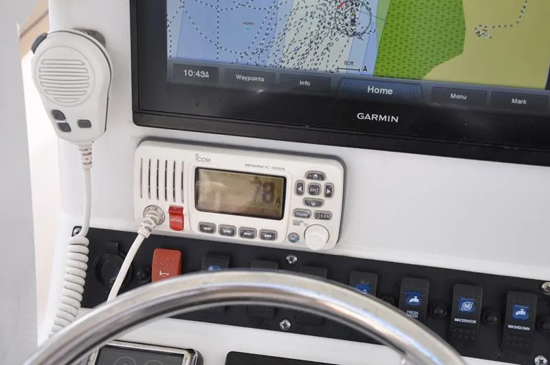 Slide: The Image of Control panel of 2015 Sea Hunt Gamefish 30 with Garmin GPS and Icom radio. - 15