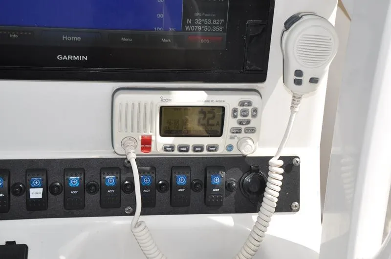Slide: The Image of Control panel of a 2015 Sea Hunt Gamefish 30 with Garmin GPS and Icom radio. - 16