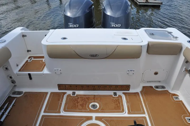 Slide: The Image of 2015 Sea Hunt Gamefish 30 boat deck with twin Yamaha 300 engines. - 24