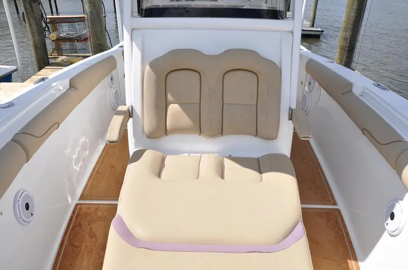 Slide: The Image of 2015 Sea Hunt Gamefish 30 boat interior with beige seating and white accents. - 30