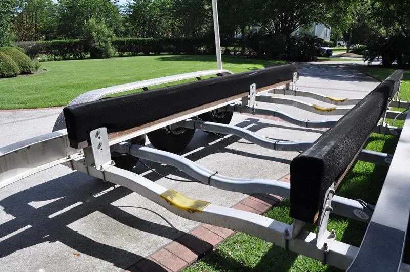 Slide: The Image of Boat trailer for 2015 Sea Hunt Gamefish 30 on a driveway. - 34