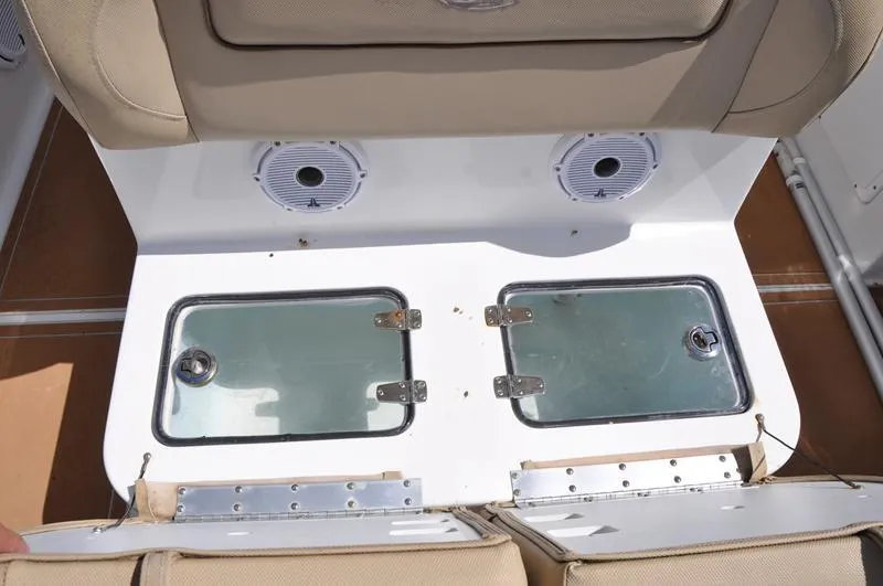 Slide: The Image of 2015 Sea Hunt Gamefish 30 boat seating with storage compartments and speakers. - 8
