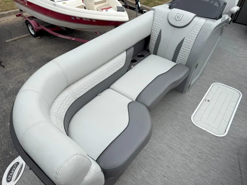 Slide: The Image of 2021 Godfrey Monaco 215 C boat interior with gray and white seating. - 7