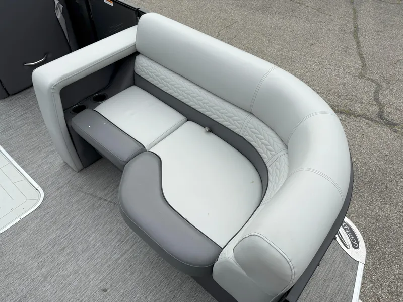 Slide: The Image of Luxurious seating on 2021 Godfrey Monaco 215 C pontoon boat, featuring elegant gray upholstery. - 8
