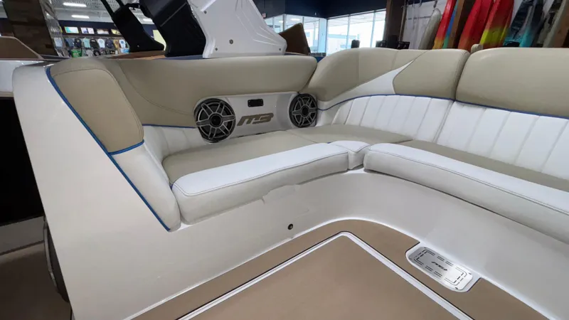 Slide: The Image of 2025 MB B52 23 Classic boat interior with beige and white seating, featuring built-in speakers. - 15