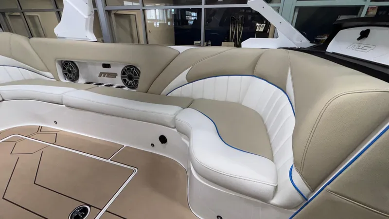Slide: The Image of Luxurious interior of 2025 MB B52 23 Classic boat with beige and white seating. - 17