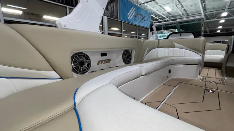 Slide: The Image of Luxurious interior of 2025 MB B52 23 Classic boat with premium seating and sound system. - 19