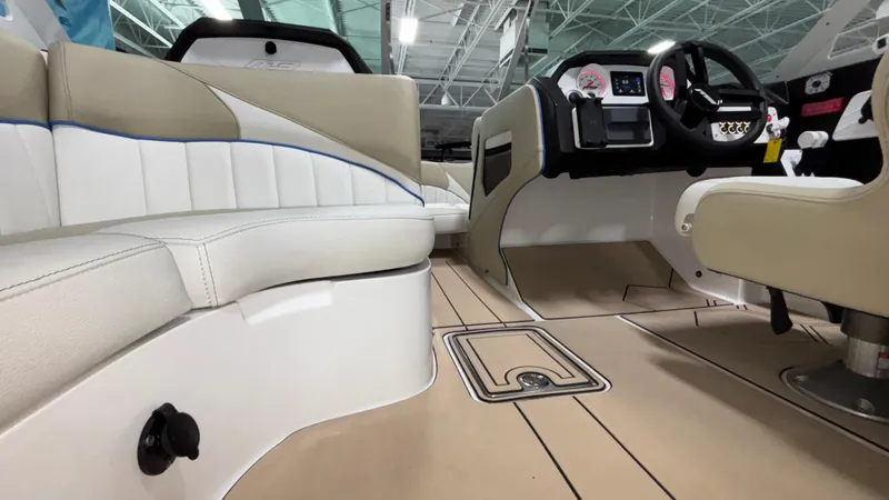 Slide: The Image of 2025 MB B52 23 Classic boat interior with beige seating and modern dashboard. - 21