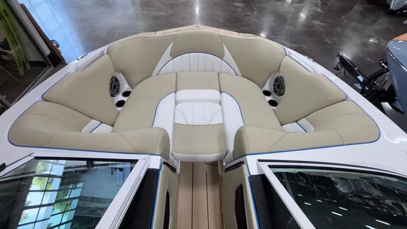 Slide: The Image of Luxurious interior of 2025 MB B52 23 Classic boat with beige seating and speakers. - 23