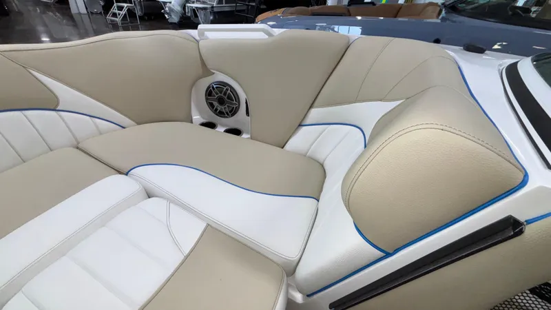 Slide: The Image of Luxurious interior of 2025 MB B52 23 Classic boat with beige and white seating. - 25