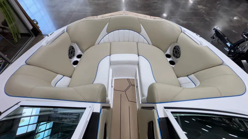 Slide: The Image of 2025 MB B52 23 Classic boat interior with beige seating and built-in speakers. - 28