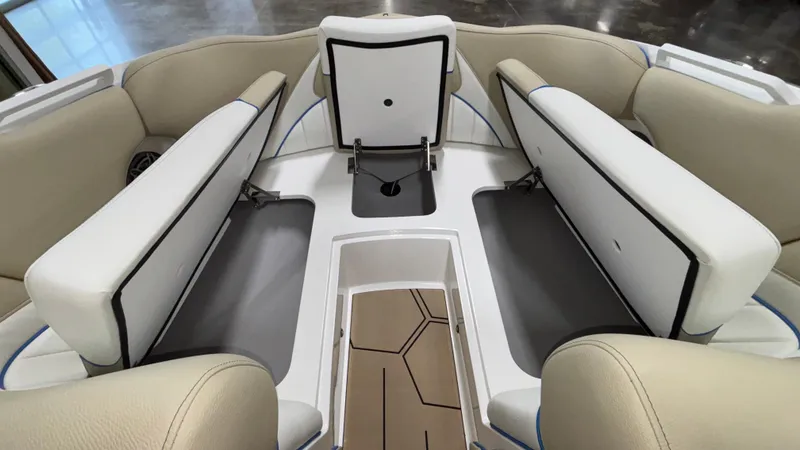 Slide: The Image of 2025 MB B52 23 Classic boat interior with beige and white seating, open storage compartments. - 29