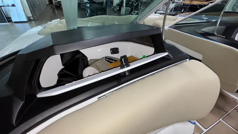 Slide: The Image of 2025 MB B52 23 Classic boat interior with beige seating and storage compartment. - 33