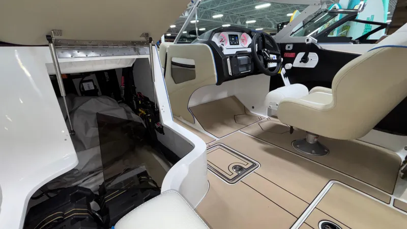 Slide: The Image of Interior of 2025 MB B52 23 Classic boat with modern dashboard and beige seating. - 34