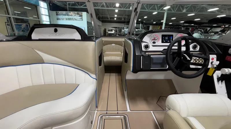 Slide: The Image of Interior of 2025 MB B52 23 Classic boat with modern dashboard and seating. - 36