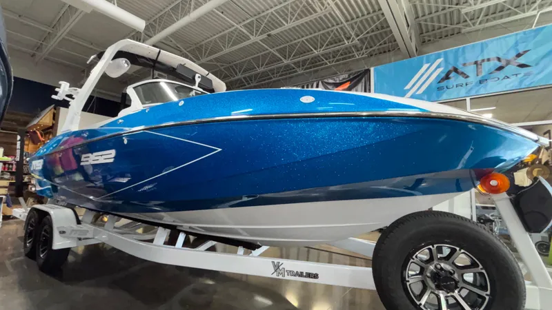 Slide: The Image of 2025 MB B52 23 Classic boat in showroom, blue exterior, on trailer. - 4