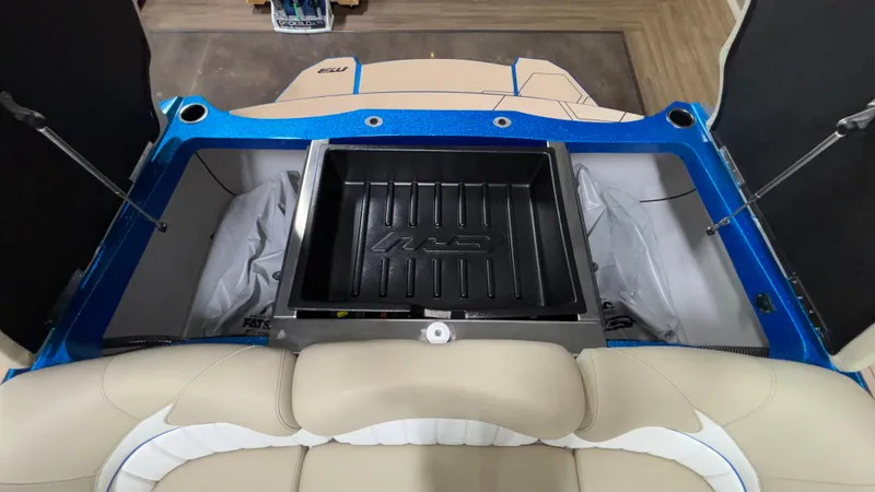 Slide: The Image of 2025 MB B52 23 Classic boat interior with storage compartment and beige seating. - 44