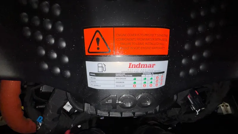 Slide: The Image of Engine cover of 2025 MB B52 23 Classic with Indmar label and warning sticker. - 46