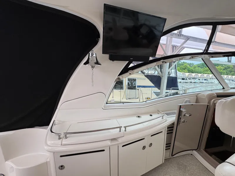 Slide: The Image of Luxurious interior of a 2003 Sea Ray 500 Sundancer yacht with plush seating and helm. - 10