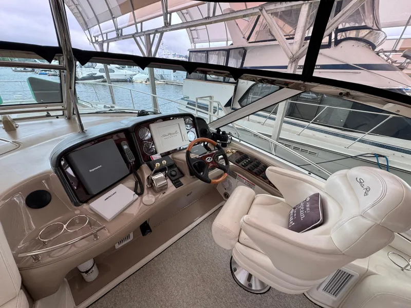 Slide: The Image of Interior of 2003 Sea Ray 500 Sundancer yacht with sink, TV, and marina view. - 13