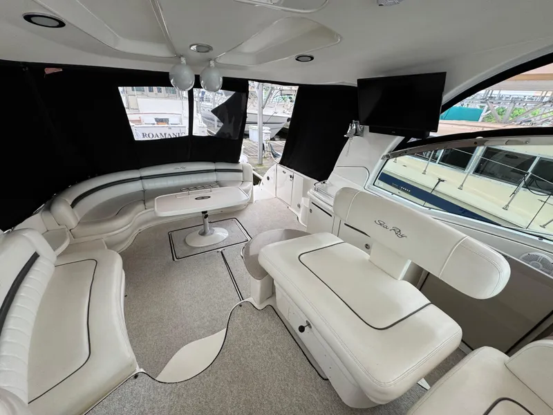 Slide: The Image of Cockpit of 2003 Sea Ray 500 Sundancer yacht with steering wheel and navigation equipment. - 15